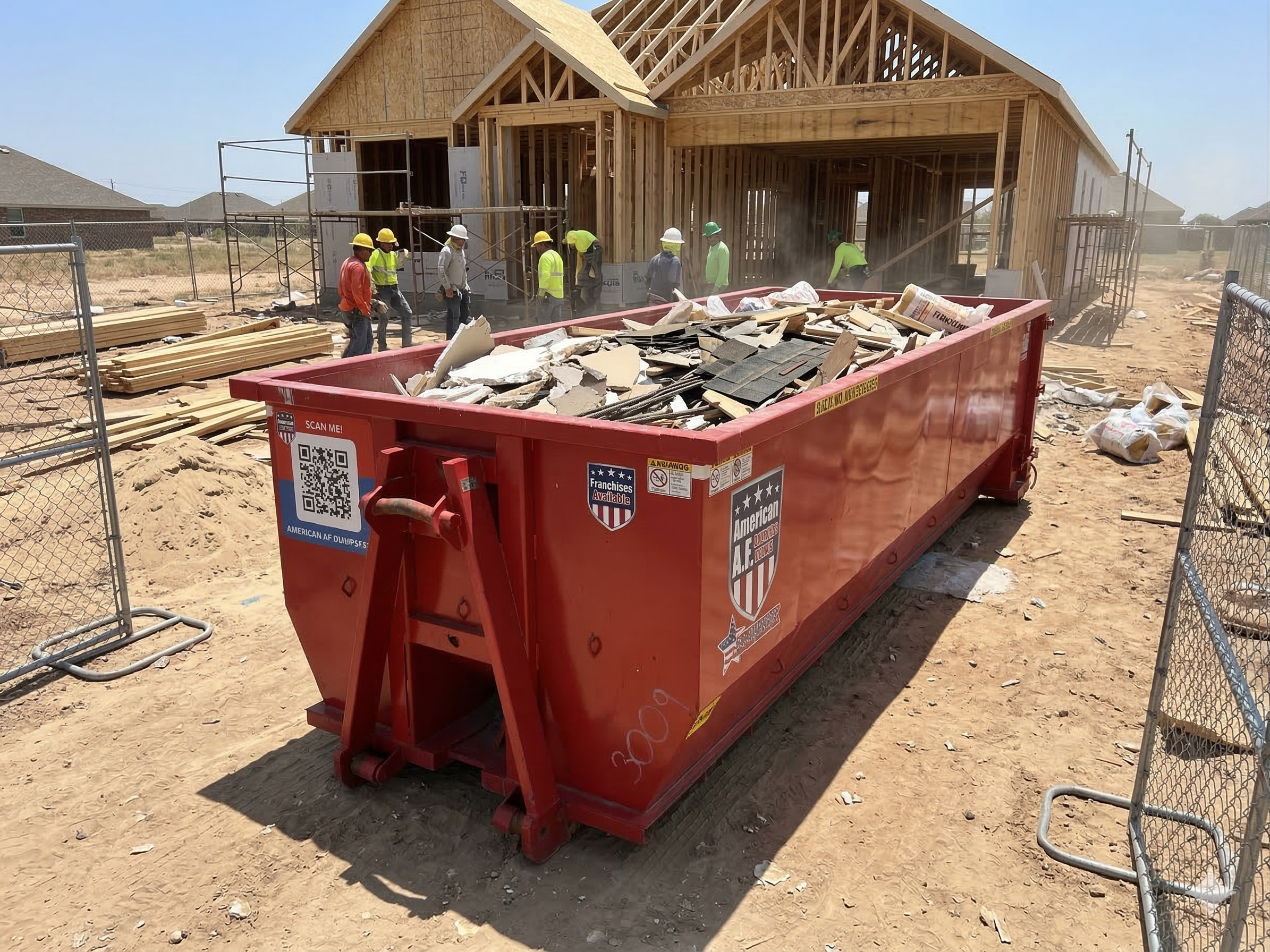 Red dumpster at an active construction site